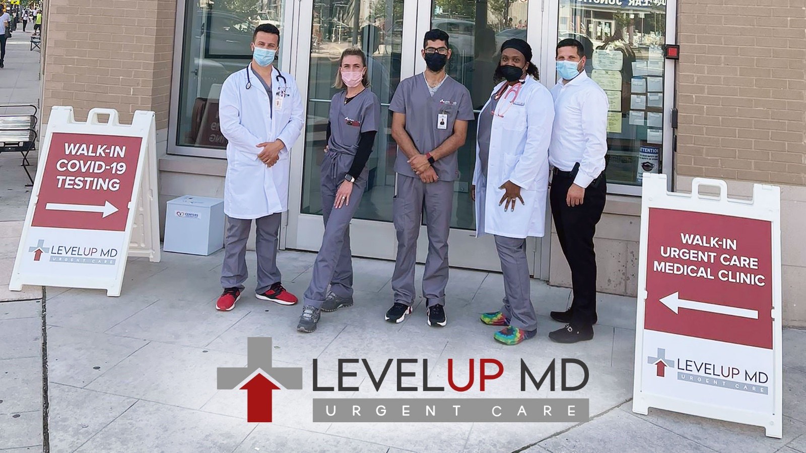 Staff of Bloomfield, New Jersey location in front of entrance - Level Up MD
